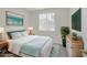 Cozy bedroom featuring a comfortable bed with teal accents and stylish décor at 2367 Tilden Way, Henderson, NV 89074