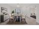 Bright dining room features modern table setting, decor and stylish light fixture at 2367 Tilden Way, Henderson, NV 89074
