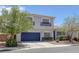 Attractive two-story house with a blue garage door, desert landscaping, and well-maintained front yard at 2367 Tilden Way, Henderson, NV 89074