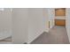 Neutral hallway with carpet, storage, and access to a bathroom for practical living at 2367 Tilden Way, Henderson, NV 89074