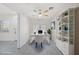 Bright home office featuring white desk, storage and a ceiling fan at 2367 Tilden Way, Henderson, NV 89074