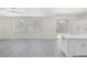 Bright living room with sliding glass doors, and open floor plan to kitchen and island at 2367 Tilden Way, Henderson, NV 89074
