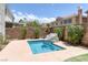 Backyard pool with rock feature and mature landscaping for privacy at 2367 Tilden Way, Henderson, NV 89074