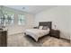 Cozy bedroom with carpet, two windows with blinds, a queen size bed and two night stands at 2555 Hampton Rd # 2108, Henderson, NV 89052