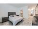 Neutral bedroom with a queen size bed and two nightstands with a walk-in closet and carpeted floors at 2555 Hampton Rd # 2108, Henderson, NV 89052