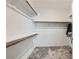 Empty closet with white shelving and carpeted floors at 2555 Hampton Rd # 2108, Henderson, NV 89052