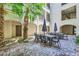 Courtyard with beautiful palm trees and outdoor seating area at 2555 Hampton Rd # 2108, Henderson, NV 89052