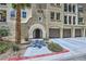 Close up of the condo entrance, featuring landscaping, and private garages at 2555 Hampton Rd # 2108, Henderson, NV 89052