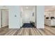 Bright entryway with wood floors, leading to an open-concept kitchen and living space at 2555 Hampton Rd # 2108, Henderson, NV 89052