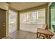 A covered patio featuring a comfortable chair and pull down sunshades, perfect for outdoor relaxation at 2555 Hampton Rd # 2108, Henderson, NV 89052
