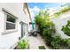 Relaxing backyard with a patio, an umbrella, and beautiful garden space at 285 Rain Quail Way, Henderson, NV 89012