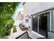 Inviting backyard with stone patio, seating, and easy access to indoors at 285 Rain Quail Way, Henderson, NV 89012