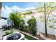 Private backyard with lush landscaping, a patio, and comfortable seating at 285 Rain Quail Way, Henderson, NV 89012