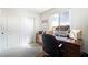 Bedroom with wooden desk and closet at 285 Rain Quail Way, Henderson, NV 89012