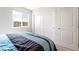 Bright bedroom with a large window, closet, and plush bedspread at 285 Rain Quail Way, Henderson, NV 89012
