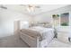 Bedroom featuring neutral walls, carpet, ceiling fan and wardrobe at 285 Rain Quail Way, Henderson, NV 89012