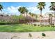 Community pool and garden area with lush greenery and ample space for relaxing at 285 Rain Quail Way, Henderson, NV 89012