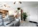 This living room features leather seating, tile floors and kitchen access at 285 Rain Quail Way, Henderson, NV 89012