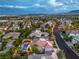 A captivating aerial view of a residential neighborhood with well-maintained homes and mature landscaping at 2982 Hammerwood Dr, Las Vegas, NV 89135
