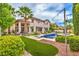 A spacious backyard with a pool, artificial turf, and a patio is perfect for entertaining and relaxation at 2982 Hammerwood Dr, Las Vegas, NV 89135
