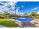 Community basketball court with pristine blue and gray surface, lighting, and green surroundings at 2982 Hammerwood Dr, Las Vegas, NV 89135