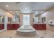 Luxurious bathroom with a soaking tub, double vanity, and modern fixtures at 2982 Hammerwood Dr, Las Vegas, NV 89135