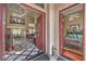 Open foyer featuring tile floors, high ceilings, and an ornate staircase at 2982 Hammerwood Dr, Las Vegas, NV 89135