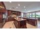 Gourmet kitchen featuring a large center island, custom cabinetry, and high-end appliances for cooking at 2982 Hammerwood Dr, Las Vegas, NV 89135