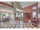 Open-concept living area with vaulted ceiling and large windows showcasing the backyard at 2982 Hammerwood Dr, Las Vegas, NV 89135