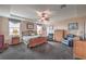 Spacious main bedroom featuring tray ceilings, a ceiling fan and plenty of natural light at 2982 Hammerwood Dr, Las Vegas, NV 89135