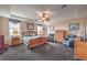 Spacious main bedroom features a ceiling fan, sitting area, and ample natural light at 2982 Hammerwood Dr, Las Vegas, NV 89135