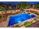 Backyard pool with hot tub, diving board, and surrounding lush landscaping provides ideal recreation at 2982 Hammerwood Dr, Las Vegas, NV 89135