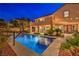 Enjoy outdoor living with a private pool, covered patio, and manicured landscaping in this backyard retreat at 2982 Hammerwood Dr, Las Vegas, NV 89135