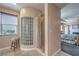 Modern shower with glass block window, tile surround, and natural light at 2982 Hammerwood Dr, Las Vegas, NV 89135