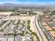 An aerial shot shows a residential area with neat rows of houses and a clear view of the neighborhood layout at 3204 Rutledge Dr, Las Vegas, NV 89120