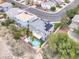 An aerial view features a home with a private pool and a lush, well-maintained backyard, with palm trees at 3204 Rutledge Dr, Las Vegas, NV 89120