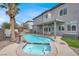 Stunning backyard pool and spa with a tiki bar, perfect for outdoor entertaining at 3204 Rutledge Dr, Las Vegas, NV 89120