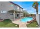 Beautiful backyard featuring a swimming pool, patio, manicured landscaping, and outdoor lights at 3204 Rutledge Dr, Las Vegas, NV 89120