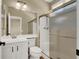 Bathroom featuring a single sink vanity and a shower with a glass door at 3204 Rutledge Dr, Las Vegas, NV 89120