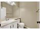 Bright bathroom with vanity and mirror, toilet, and neutral color palette at 3204 Rutledge Dr, Las Vegas, NV 89120