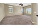 Large bedroom featuring carpet flooring, ample natural light, and neutral tones at 3204 Rutledge Dr, Las Vegas, NV 89120