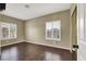 Cozy bedroom featuring hardwood floors and natural light from two windows at 3204 Rutledge Dr, Las Vegas, NV 89120