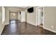 Spacious bedroom with a view, featuring hardwood floors and a mirrored closet at 3204 Rutledge Dr, Las Vegas, NV 89120