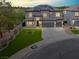 Spacious two-story home with a three-car garage, well-manicured lawn, set against a twilight backdrop at 3204 Rutledge Dr, Las Vegas, NV 89120