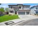 Two-story home features a three-car garage, manicured lawn and classic architecture at 3204 Rutledge Dr, Las Vegas, NV 89120