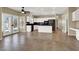 Large kitchen features stainless steel appliances, white cabinetry, black granite countertops, and backyard access at 3204 Rutledge Dr, Las Vegas, NV 89120