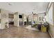 Virtually staged living room featuring fireplace, neutral color palette, recessed lights, and tile flooring at 3204 Rutledge Dr, Las Vegas, NV 89120
