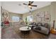 Living room featuring neutral walls, plush carpet, custom artwork, and a fun game area at 3204 Rutledge Dr, Las Vegas, NV 89120