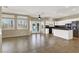 Spacious living room featuring tile flooring, white shutters, and direct access to the outdoor pool area at 3204 Rutledge Dr, Las Vegas, NV 89120