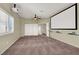 Spacious media room with plush carpeting, neutral walls, and a large projection screen at 3204 Rutledge Dr, Las Vegas, NV 89120